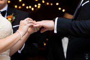 bride and groom exchange rings