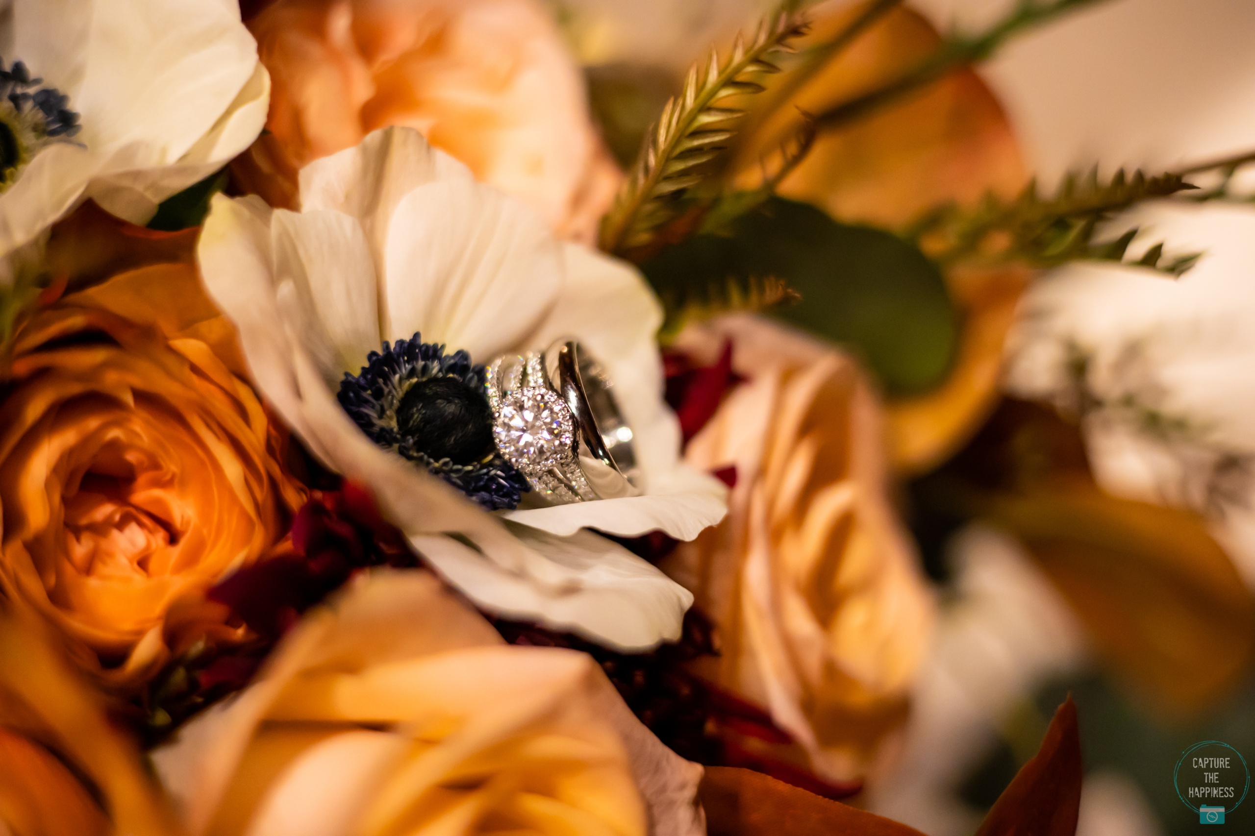 wedding rings among flowers