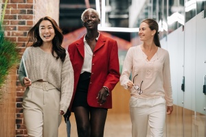 group of women friends walking and laughing