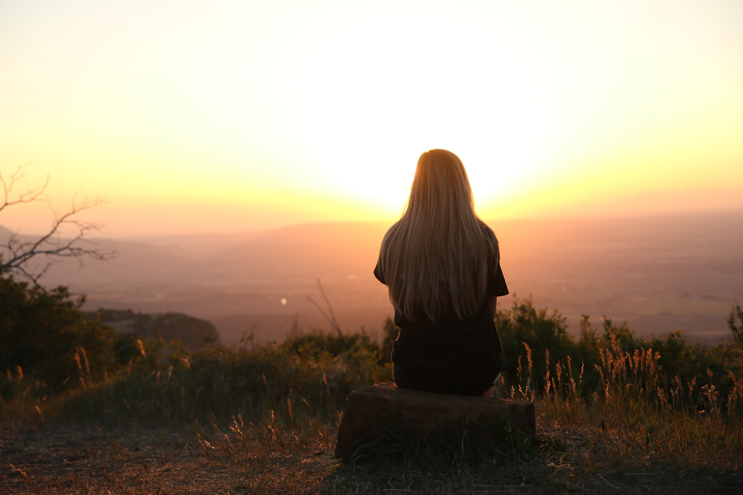 woman watching sunset